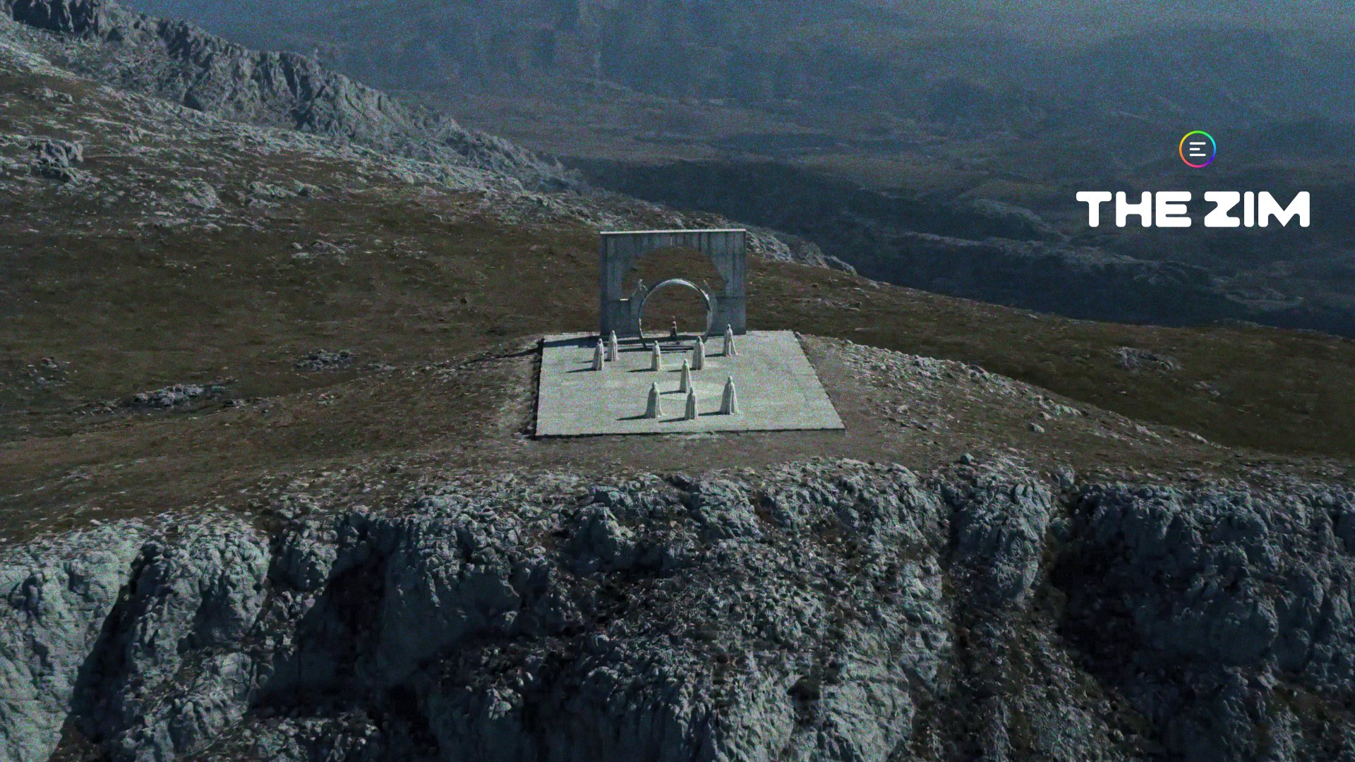 Aerial view of a lone stone altar on a windswept cliff plateau, high above a rugged mountain landscape.